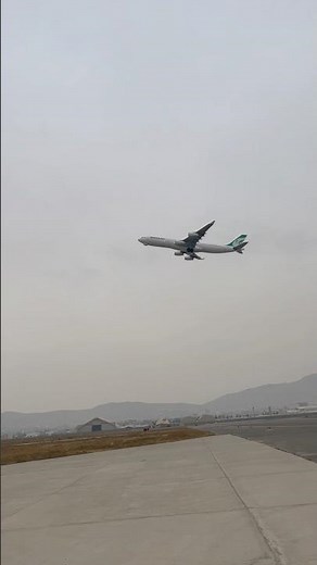 Airbus A340 taking off from the runway Four engines lifting into flight