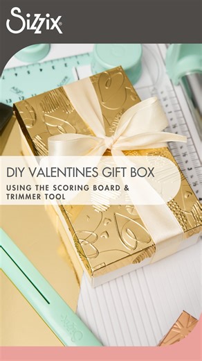 Sizzix on Instagram: "Love is in the details 💕 Create a custom-sized box with the Sizzix Scoring Board & Trimmer, then add a luxe touch with a heart-embossed lid in Gold Opulent Cardstock. Perfect for wrapping love in any size, because handmade details make every gift sweeter. 💕 #Sizzix #Papercraft #Craft"