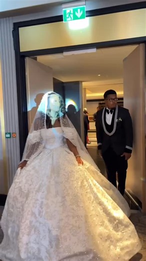 One of the most beautiful bride in a signature Victorian Gem Gown. Crafted for the bride who believes in presence, grandeur, and timeless elegance, this gown is a true statement of couture artistry. The off-shoulder neckline is delicately structured to frame the shoulders and décolletage, creating a soft yet powerful silhouette, while the sculpted bodice is fully encrusted with hand-applied embellishments that catch the light with every movement. Each crystal, bead, and pearl is placed with inte