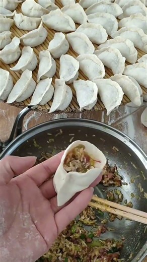 A flat spoon can spread and level the filling inside dumpling wrappers neatly at home today easily