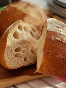My German friend taught me this dish, and my hubby has been requesting it weekly since!. Quick German Bread in Just 5 Minutes Ingredients: - 1 cup all-purpose flour - 1 tablespoon sugar - 1/2 teaspoon salt - 1/2 teaspoon baking soda - 1/2 cup yogurt (plain or Greek) - 1 tablespoon melted butter (plus extra for greasing) - Optional: caraway seeds or sesame seeds for topping Instructions: 1. In a mixing bowl, combine the flour, sugar, salt, and baking soda. Mix well to ensure all dry ingredients a