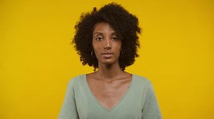 Woman Making Shushing Gesture On Yellow Stock Footage Video (100% Royalty-free) 3565467353 | Shutterstock