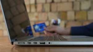 Typing bank details on a laptop - Free Stock Video