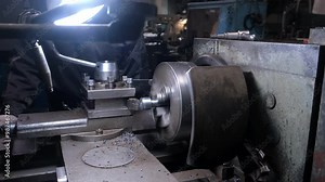 Metal worker operating working on lathe machine in workshop on factory. Turning spinning metal part in factory floor. Metalworking metallurgical industry, automated machinery production manufacturing. Stock Video