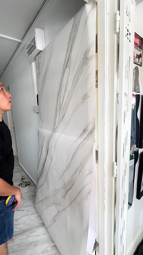 Wrapping a main door with an our interior film can give your door a fresh look, protect it, and even add decorative elements. Select a film that is suitable for interior use and matches your design preferences. Options include solid colors, texture stones, wood grain patterns and decorative prints. #doors #door #wrapping #viny #LG #lghausys #lgbeninofficiel #benif #interiorfilm #vinylwrap #stickers #tranformation #tranformers #makeover #renovation #sghome #sgrenovation #interiordesign #designer 