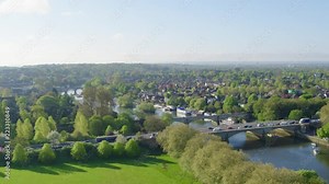 drone footage looking over a busy transport section of the UK road network and rail lines