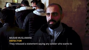 Syrian army defectors line up to register with insurgents in newly captured Aleppo