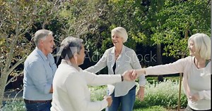 Senior people, garden and dancing with group, smile and vacation with nature, summer and party. Mature men, outdoor and old women with happiness, freedom and cheerful with holiday, joyful and love