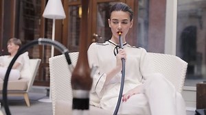 clip-1017054421-shisha-bar-beautiful-woman-smoking-hookah-restaurant