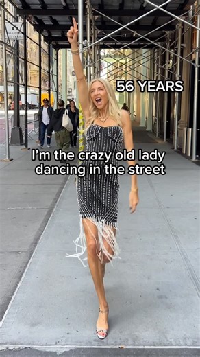 Sue Giers on Instagram: "This is my story: at 56, I am that “crazy old lady” dancing in the street. But let me tell you why: I don’t dance for attention. I dance because life is too short to hide. I dance to celebrate life, people, freedom. 💃💫 I was once a single mom of three kids. I had no money, no job, no safety net. But I had a dream. Step by step, I started over, built my own fashion label, and created a new life from zero. And if I can do it, so can you. 🌍✨ Age doesn’t define what’s pos