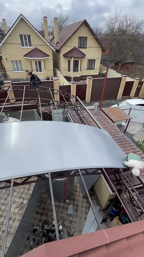 Curved Metal Roof Installation at a Construction Site