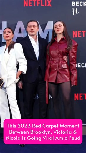 This clip is going viral now that Brooklyn Beckham has broken his silence on his family feud with parents David and Victoria Beckham. In the video from the 2023 red carpet premiere of Netflix's 'Beckham,' Brooklyn is seen pulling his wife, Nicola Peltz, into the group shot next to his mother, Victoria. Earlier this week, Brooklyn made it clear in a series of public messages that he has no plans to reconcile with his family. (🎥: Getty Images) | Hollywood Life