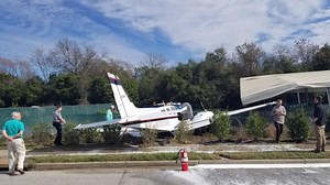 Plane crashes off runway and onto road in Augusta