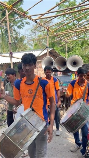 Boys playing musical instruments are taking part in a water pouring procession at Islampur Mahade...