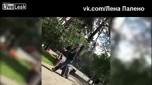 Girl walks on a leash like a dog .