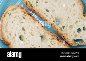Slices of Italian rustic soft wheat bread from Lazio region.Close-up,rotating video.