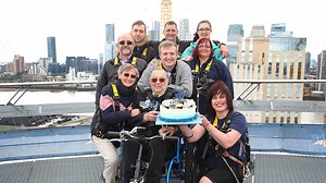100-year-old celebrates birthday by climbing O2 in wheelchair