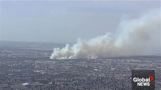 Large grass fire breaks out in west Edmonton along Anthony Henday Drive