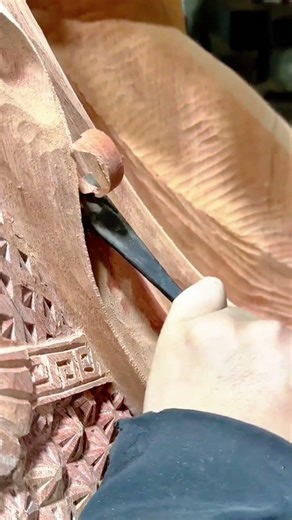 carving detailed wooden patterns using sharp tools to create beautiful traditional art masterpieces