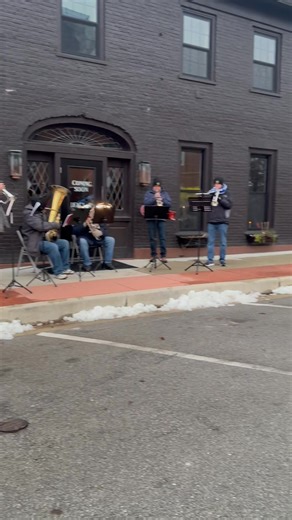 Brass band at the Deaglan Town Square Grill at 2025 Home for the Holidays on the Versailles Town Square.￼ | Main Street Versailles
