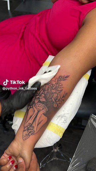 Detailed Flower Tattoo on Forearm in Tattoo Studio