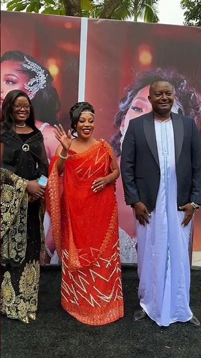 Pastor Bujingo and Susan Makula arrive at Bad Black's introduction ceremony