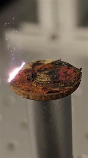 Using a laser on damaged, rusty coins to clean them