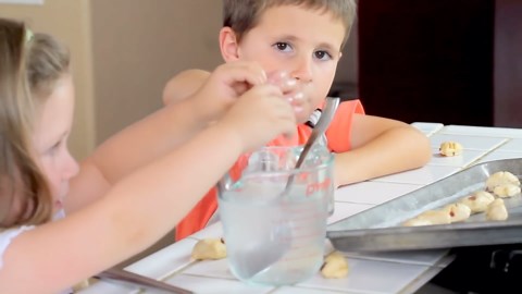 Homemade bacon-cheddar pretzel bites with cheese sauce