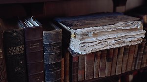 old library with shelves of antique books.