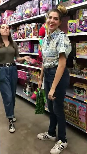 two lesbians kiss in the Walmart toy section