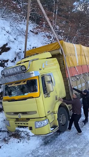 Freeing a Stuck MAN Truck in Snowy Conditions