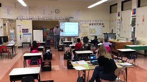 A view inside a kindergarten hybrid classroom. Co-teacher in the classroom supporting online students, small in person numbers, classroom teacher giving love to the “Zoomers” at home. Great job by our staff and our little learners. | West Orange Public Schools, NJ