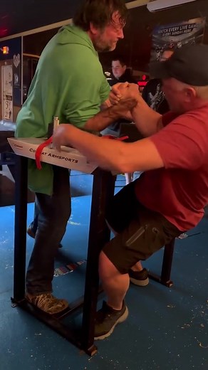 Arm Wrestling Match: Green Hoodie vs Red Shirt