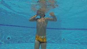 clip-12587753-underwater-swimming-boy-swims-pool