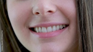 Beautiful wide smile of a young fresh woman with excellent healthy white teeth. Isolated over background Smile of a charming girl with perfect white teeth close up. Perfect white teeth and a smile