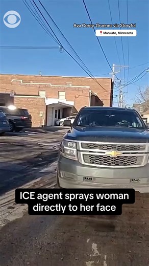 An ICE agent sprayed a chemical irritant directly at a woman as federal agents clashed with protesters in Mankato, Minnesota on Monday. Footage taken from Ava Corey-Gruenes shows a masked agent getting out of a truck and telling protesters to move from the front of the vehicle before lifting the canister and spraying toward her face. The incident comes days after 2,000 federal agents were deployed to Minnesota and the fatal shooting of Renee Good by an ICE agent, Jonathan Ross. | CBS News