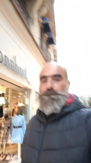 Stylish Mannequin Displays in Urban Retail Window