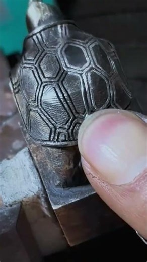 attaching wire to a turtle-shaped wooden carving#handmade #youtubeshorts