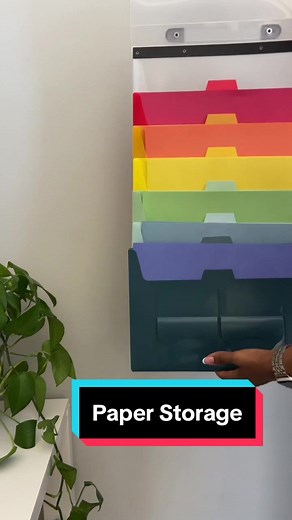 This rainbow colored hanging file folder is perfect for storing construction paper. It has a loop to easily hang when in use and folds easily for easy storage. #kidsart #kidsartideas #playroominspo #playroomgoals #playroomideas