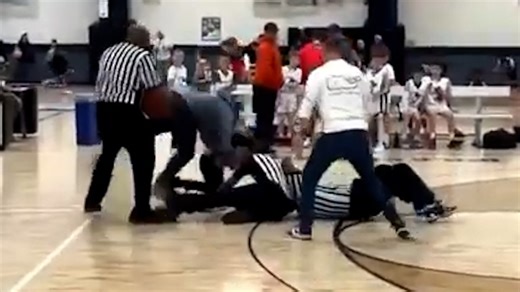 A fight broke out during the fourth quarter of a youth basketball game, but it wasn't the players that needed to be broken up. | USA TODAY Video