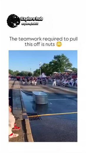 Explore hub on Instagram: "The video captures a "Buckets" event from firefighter competitions, where a team of 12 climbs a 40-foot ladder to pass and pour water buckets into a barrel, achieving flawless synchronization in under 40 seconds amid a cheering crowd at a U.S. motorsport festival. Posted by @InternetHOF , a curator of viral clips with 1.4 million followers, it highlights the post's theme of "nuts" teamwork, sparking 57 replies praising trust and practice while critiquing the event's sp