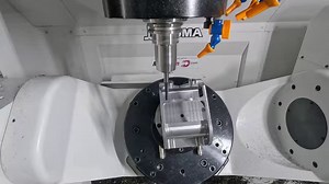 Watch as we precision machine an Aerospace bracket out of a 1018 Steel block on an Okuma America Corporation M460V-5AX utilizing Multiaxis Pocketing 5 Axis Roughing, Dynamic Motion and Deburr Toolpaths. | Mastercam
