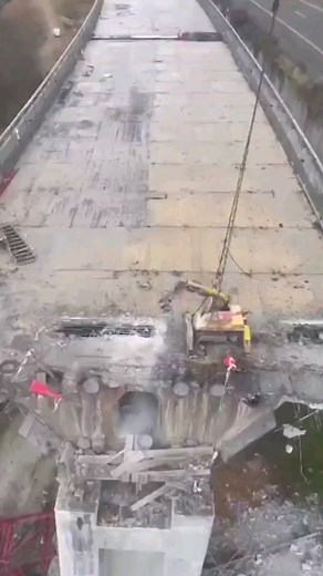 Engineering Principles on Instagram: "Demolishing a bridge using a rope hanging excavator typically involves planning and preparation, setting up the excavator on a platform or scaffold above the bridge, attaching a rope or cable to the excavator and securing it to the bridge structure, using the excavator to break up the bridge into manageable pieces, and removing the debris from the site. The exact process may vary depending on the specific bridge and equipment being used. Safety is of utmost 