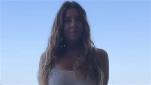 Imogen Thomas shows off the results of her boob job as she strips to tiny bikini