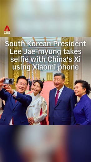 South Korean President Lee Jae-myung took a selfie with China's Xi Jinping using a Xiaomi phone that was gifted to him by Xi last November during the Asia-Pacific Economic Coorperation (APEC) Summit in South Korea. Lee had jokingly asked Xi if the device had a "backdoor" spying software installed. | CNA