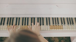 Top view of a girl playing a piano - Free Stock Video