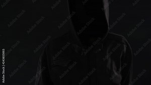 Hooded computer hacker click virtual screen, low key slow motion footage for text or graphics mock up Stock Video