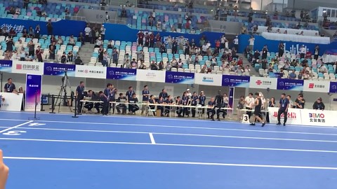 Automaton runs over to race referees at robot Olympics in China