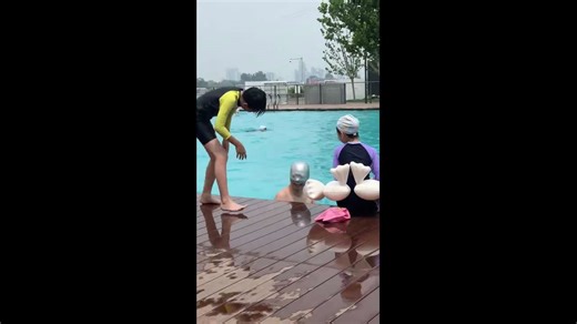 Boy drops water-filled swim cap on man’s head in Beijing, China