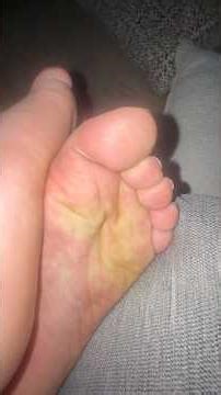 Giant male feet close up tops and soles